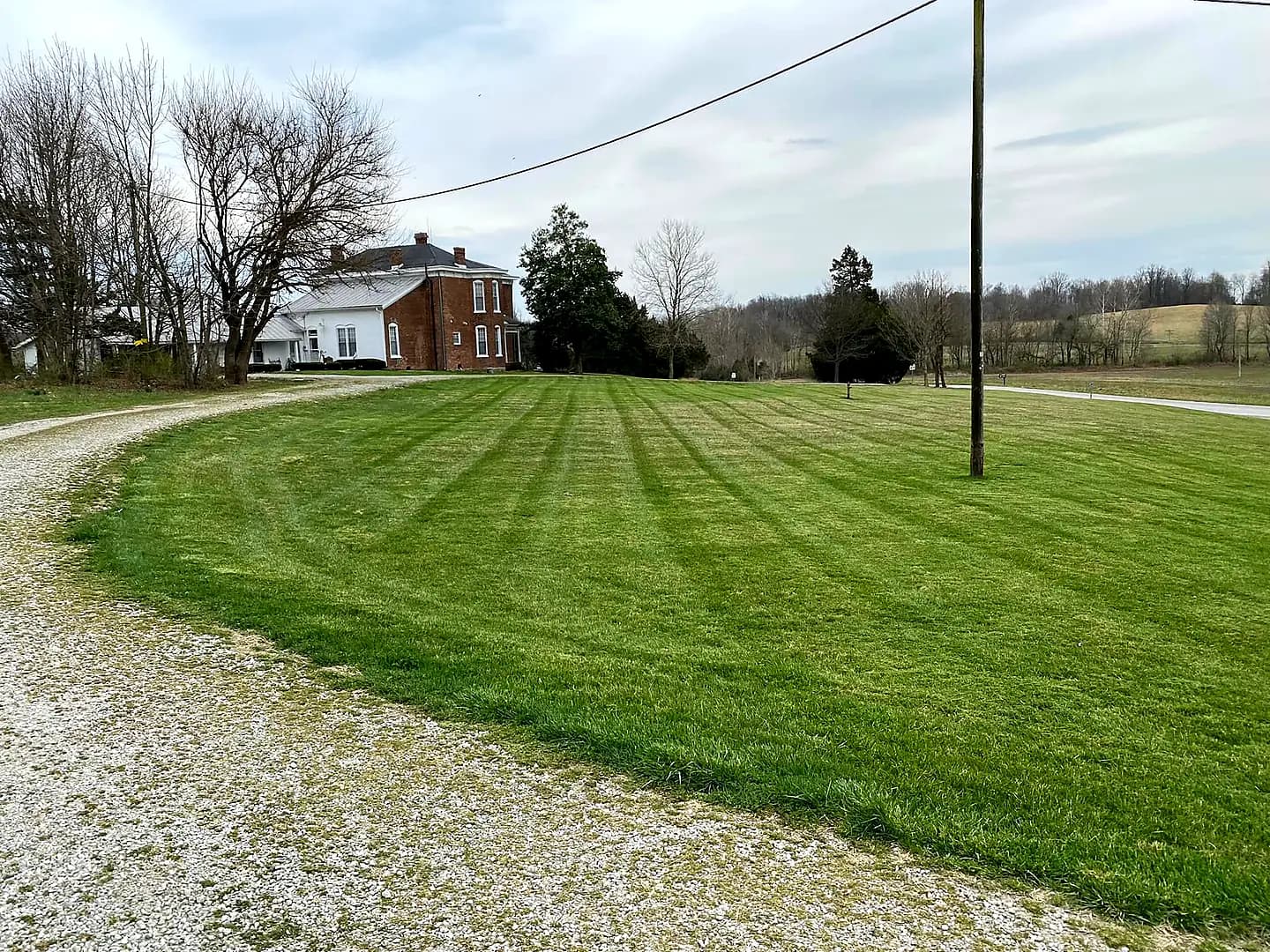 Kirk's Mowing crew maintaining a commercial property in Scott County, Indiana
