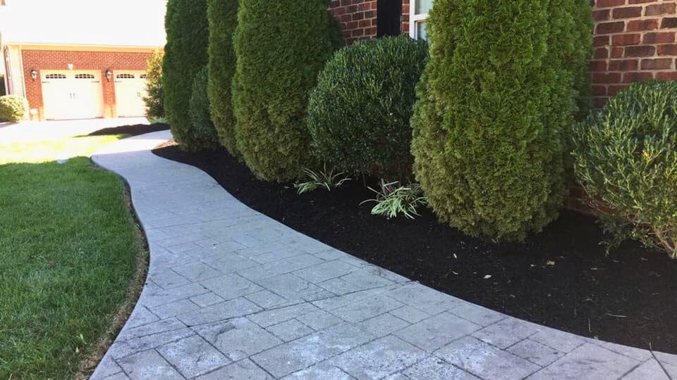 Lush green lawn maintained by Kirk's Mowing & Landscaping